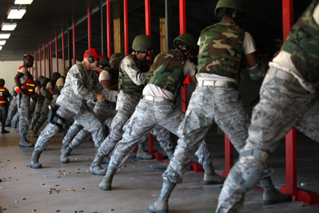 Airmen from the 560th Red Horse Squadron,  Joint Base Charleston, S.C. qualify for combat arms training and maintenance October 15, 2011 at JB CHS. (U.S. Air Force photo by Staff Sgt. Rashard Coaxum)