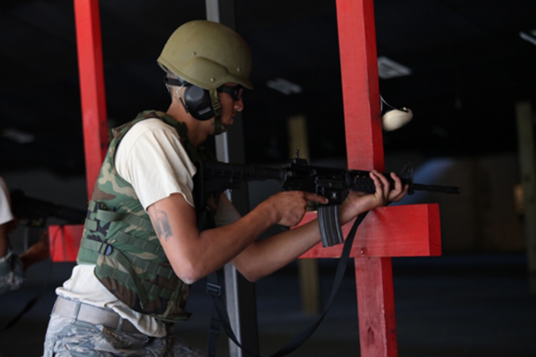 Senior Airman Jabarie Hughes, a member of the 560th Red Horse Squadron at Joint Base Charleston, S.C., conducts combat arms qualification training October 15, 2011 during the scheduled Unit Training Assembly (UTA) weekend. (U.S. Air Force photo by Staff Sgt. Rashard Coaxum)