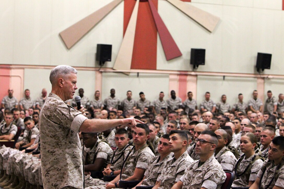 Commandant of the Marine Corps Gen. James F. Amos tells Marines with the Marine Corps Communication-Electronics School that the Corps will not leave Afghanistan until the job is done during a speech at the Sunset Cinema Theatre here, Oct. 17.