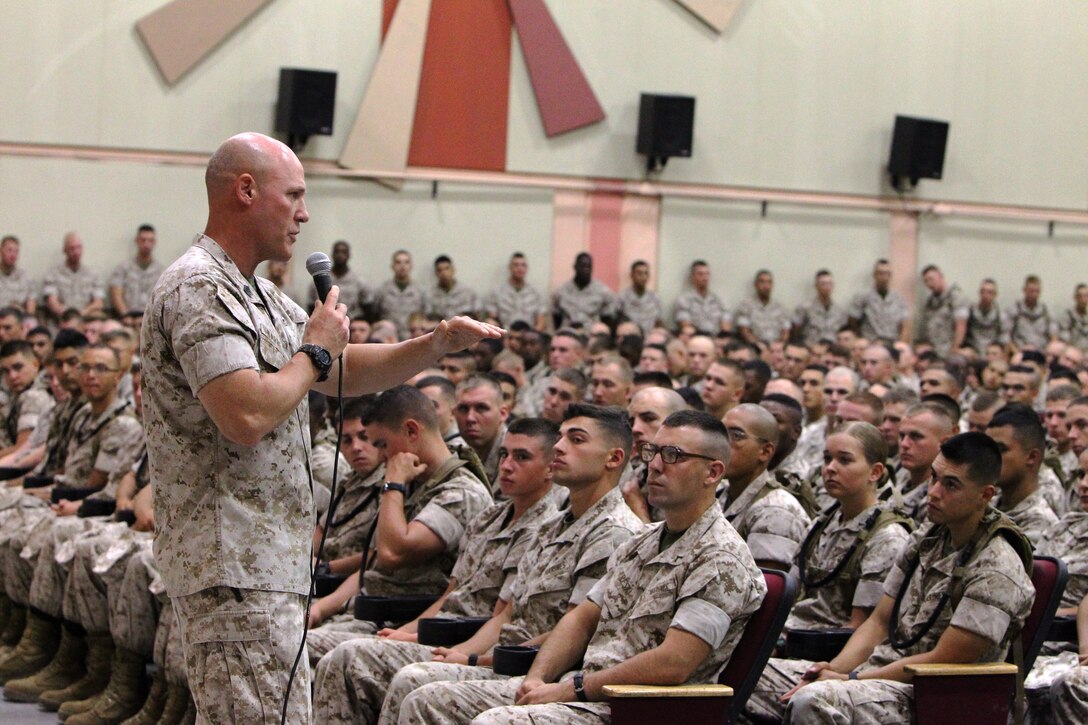 Sergeant Major of the Marine Corps Micheal P. Barrett gives a motivational speech to Marine Corps Communication-Electronics School students and staff  at the Sunset Cinema Theatre here, Oct. 17.