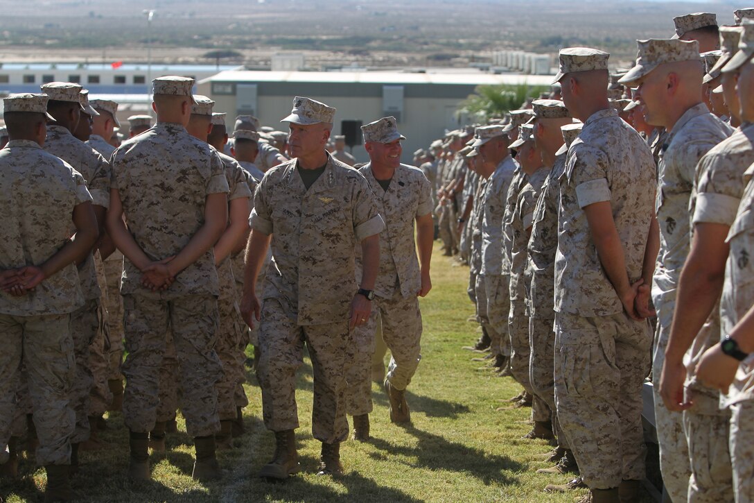 Commandant of the Marine Corps Gen. James F. Amos and Sergeant Major of the Marine Corps Micheal P. Barrett greet Marines and Sailors after a speech at Lance Cpl. Torrey L. Gray Field here,  Oct. 17.