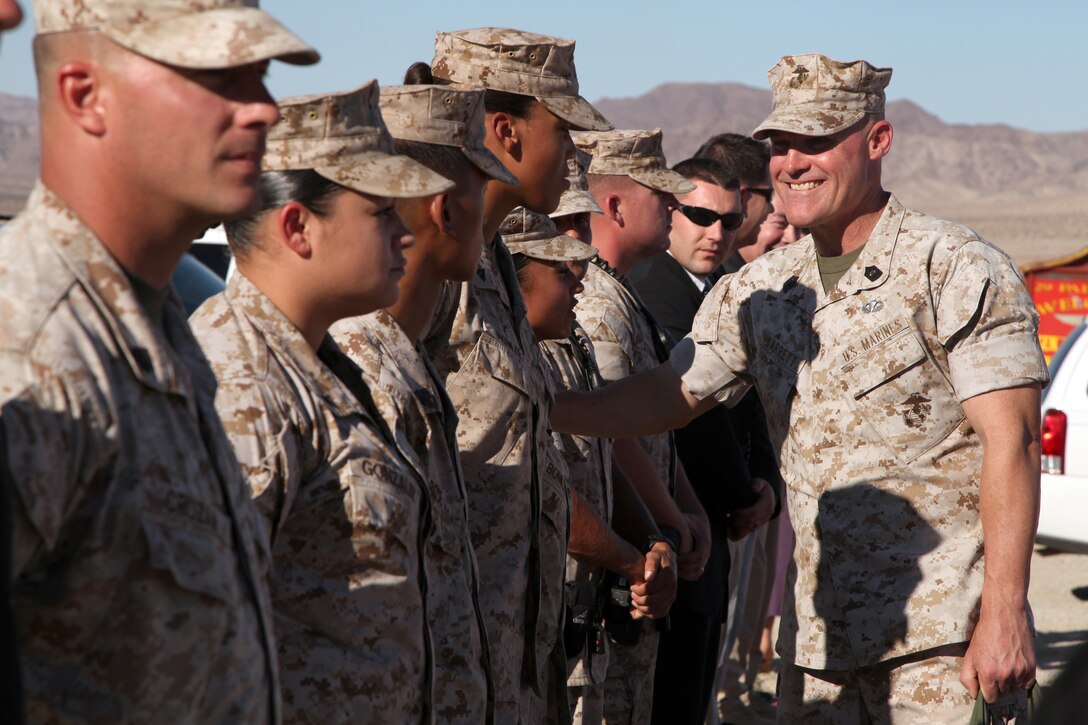 Sergeant Major of the Marine Corps Sgt. Maj. Micheal P. Barrett bids farewell to the Marines who helped make his visit to the Marine Corps Air Ground Combat Center Twentynine Palms, Calif., ,a success. Among the Marines are the vehicle drivers and security detail. Barrett accompanied Commandant of the Marine Corps Gen. James F. Amos, Amos' wife Bonnie, and his own wife, Susan, on the tour.