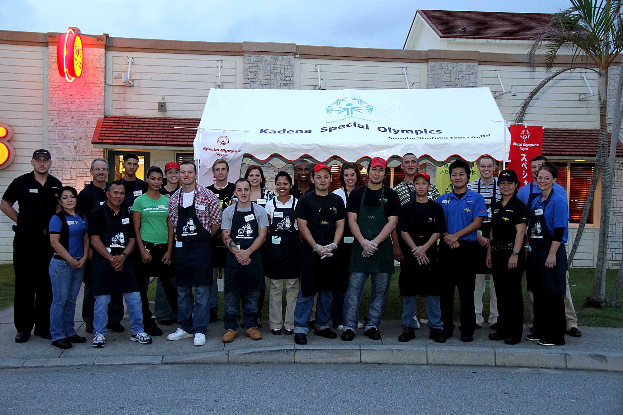 Chili's employees pose for a photo along with U.S. Air Force Security Forces members during the 2011 Kadena Special Olympics "Tip-A-Cop" event, Oct. 14. Volunteers raised more than $2,500 in support of the Special Olympics, which takes place Nov. 4 at Kadena Air Base. (U.S. Army photo/Chip Steitz)