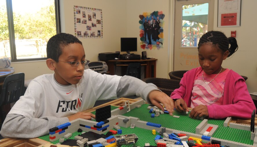Isaiah Willis, 11, son of Master Sgt. Rachonn Williamson, 2nd Aerospace Medical Squadron, and Master Sgt. Derrick Williamson, 2nd Medical Operations Squadron and Hailey Cunningham, 10, daughter of Richard Cunningham, 2nd Force Support Squadron, play  with building blocks at the youth center Oct. 17 on Barksdale Air Force Base, La. The youth center offers before-and after-school programs for children, including arts and crafts, table games, outside activities, music lessons and help with homework. (U.S. Air Force photo/Senior Airman Kristin High)(RELEASED)