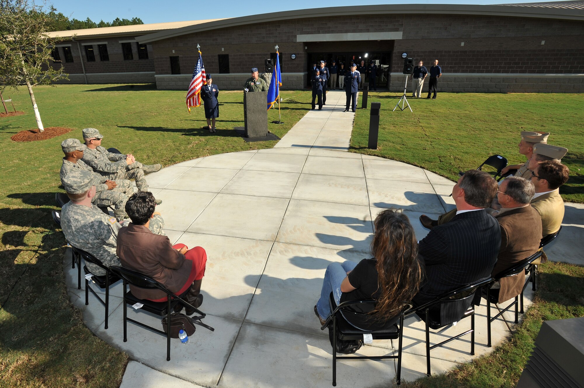 U.S. Air Force, Army, Navy, and civilian team Shaw members sit in attendance at the grand opening of Shaw's new Fitness Center Annex, Oct. 14, 2011, Shaw Air Force Base, S.C. The new fitness center provides additional space and equipment to accommodate the influx of 3rd Army personnel. (U.S. Air Force photo by Senior Airman Kenny Holston/Released) 


