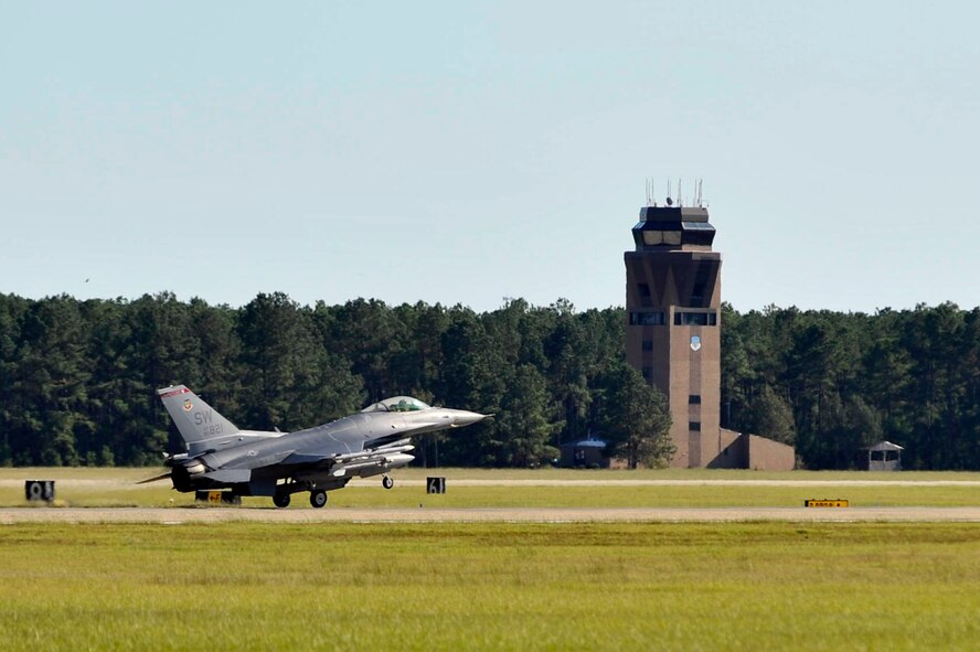 U.S. Air Force Maj. Gen Stephen Hoog, Ninth Air Force commander, lands his F-16 Fighting Falcon after his final flight as the Ninth Air Force commander, Oct. 14, 2011, Shaw Air Force Base, S.C. Final flights or fini flights have been a long standing U.S. Air Force tradition for pilots leaving their unit to be reassigned to a different unit or retiring from the Air Force. Gen Hoog is a command pilot with more than 3,000 flying hours, including 181 combat hours over Bosnia and Iraq. (U.S. Air Force photo by Senior Airman Kenny Holston/Released) 