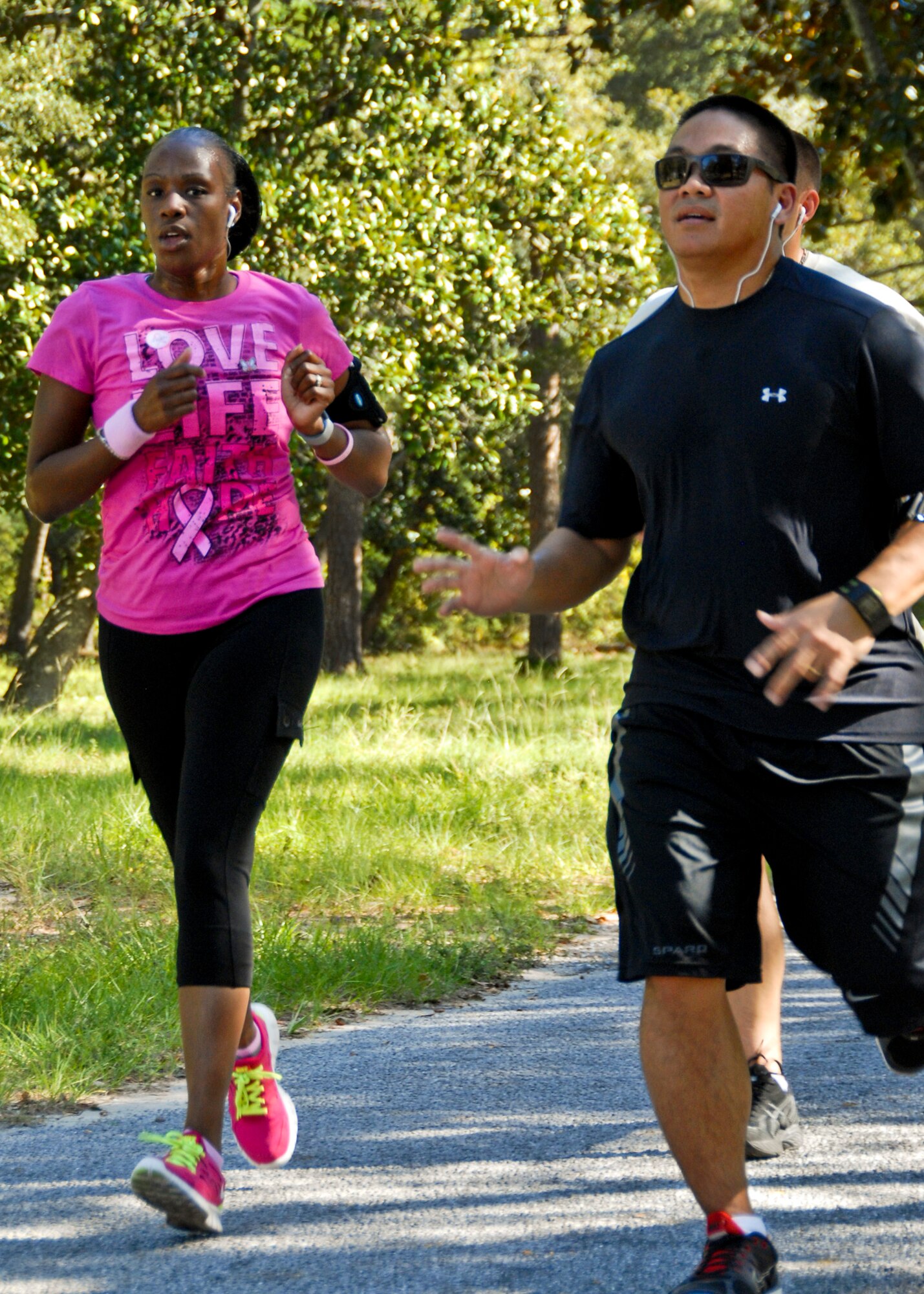 Runners participate in the Breast Cancer 5K run/walk at Eglin Air Force Base Fla., Oct. 14. The event helps to raise awareness of the importance for women to self-test and catch the disease in its early stages. More than 100 people attended the event. (U.S. Air Force photo/Sachel Seabrook)