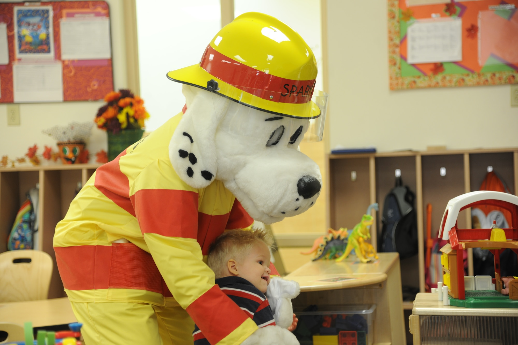 Sparky the Fire Dog 
 
Sparky the Fire Dog greets children from the Child Development Center II Oct. 13, 2011, at Moody Air Force Base; Ga. Sparky danced and sang for the kids as part of National Fire Prevention Week. (U.S. Air Force photo by Airman 1st Class Paul Francis/Released)
