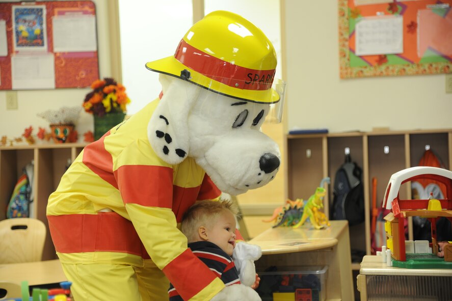 Sparky the Fire Dog 
 
Sparky the Fire Dog greets children from the Child Development Center II Oct. 13, 2011, at Moody Air Force Base; Ga. Sparky danced and sang for the kids as part of National Fire Prevention Week. (U.S. Air Force photo by Airman 1st Class Paul Francis/Released)
