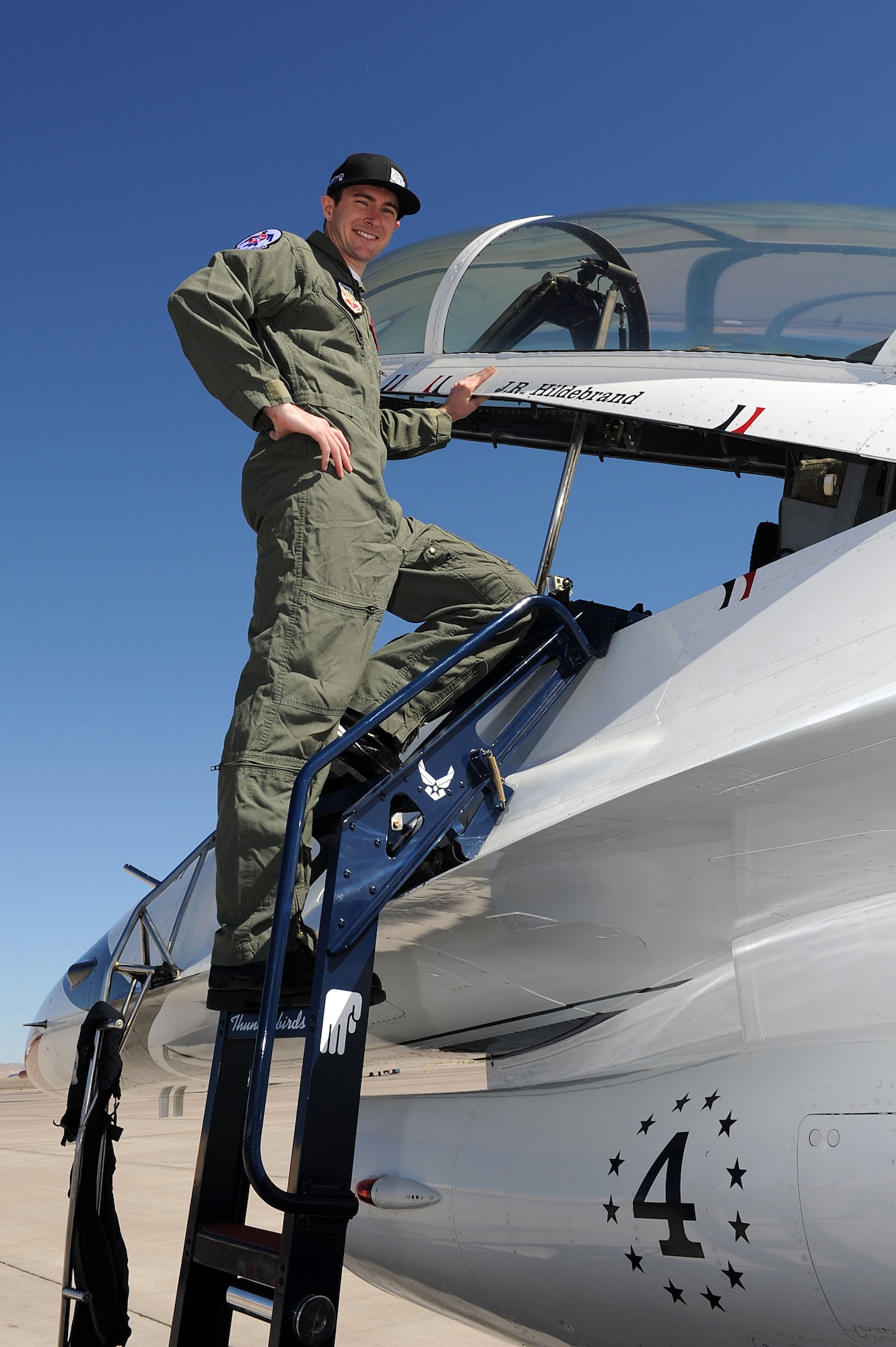JR Hildebrand, IndyCar driver, poses by his name before launching out for his Thunderbird F-16 Fighting Falcon flight Oct. 11, 2011, at Nellis Air Force Base, Nev.  Hildebrand, driver of the number four National Guard car for Panther Racing, came to Las Vegas to compete in the IZOD IndyCar World Championship at the Las Vegas Motor Speedway. (U.S. Air Force photo by Staff Sgt. Larry E. Reid Jr./Released)
