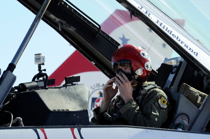 IndyCar driver JR Hildebrand, secures his mask before launching out for his Thunderbird F-16 Fighting Falcon flight Oct. 11, 2011, at Nellis Air Force Base, Nev. Hildebrand, driver of the number four National Guard car for Panther Racing, came to Las Vegas to compete in the IZOD IndyCar World Championship at the Las Vegas Motor Speedway. (U.S. Air Force photo by Staff Sgt. Larry E. Reid Jr./Released)
