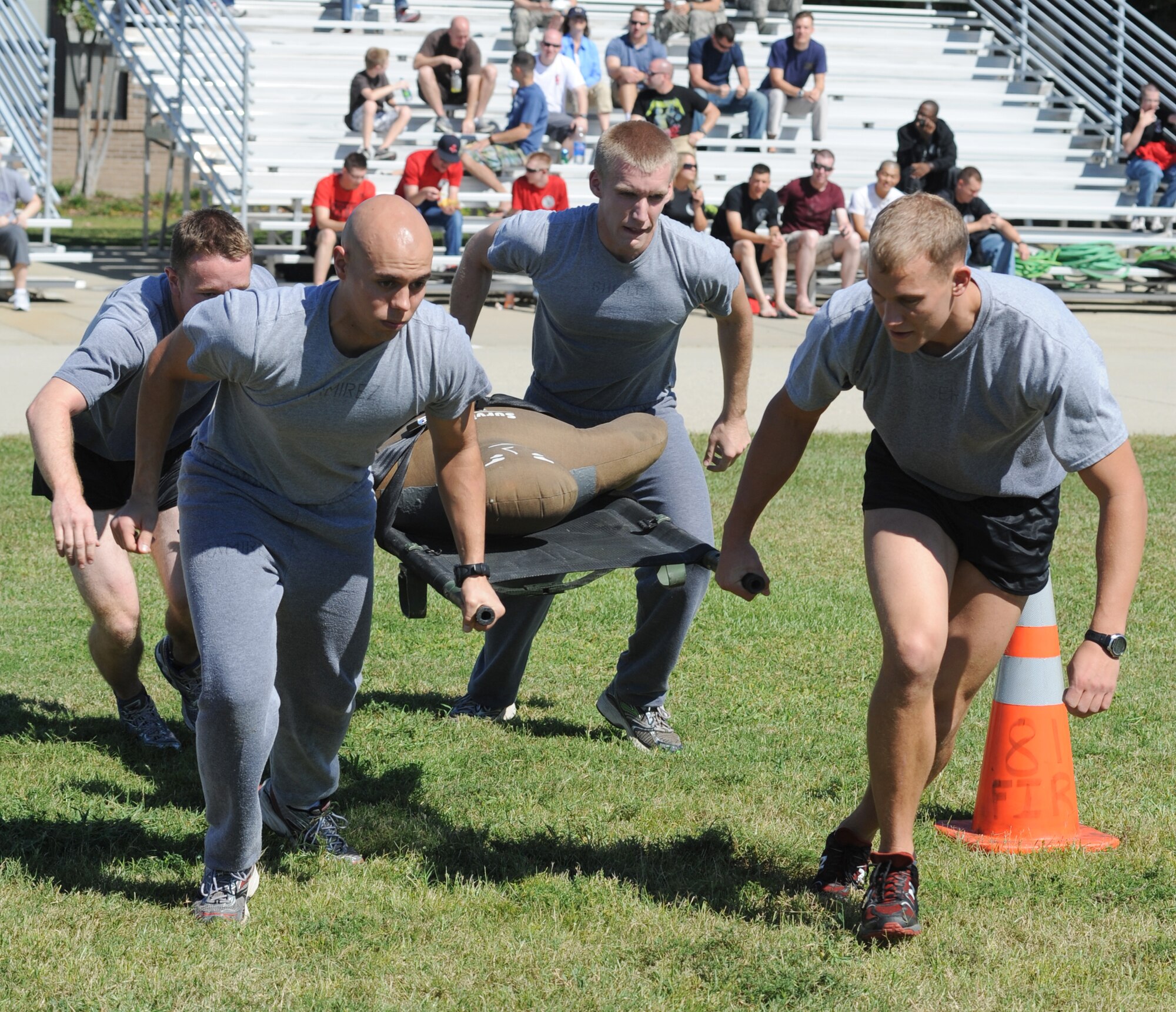 From left, Airmen 1st Class Nathan Rablee, Bret Ramirez, Michael Shipley, and Zane Gaiser, 335th Training Squadron students, participate in the “Rescue Randy” competition at the Fire Muster, Oct. 14, 2011, Keesler Air Force Base, Miss.  The Fire Muster is sponsored by the Keesler Fire Department which runs in conjunction with Fire Prevention Week Oct. 11-15, 2011.  (U.S. Air Force photo by Kemberly Groue)