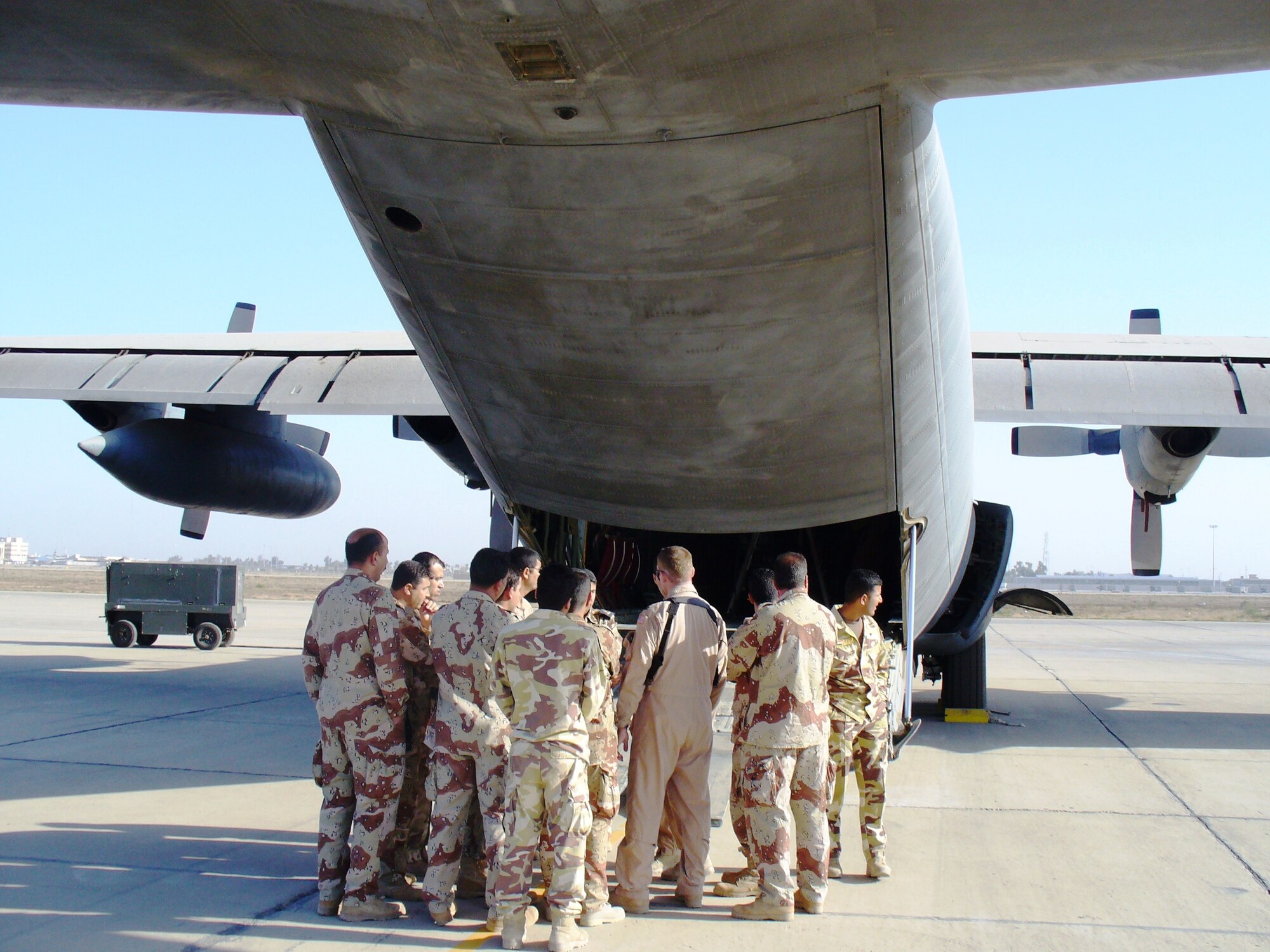 DIMO educators briefing aeromedical concepts to Iraqi C-130 and medical crew members at New Al Muthana Iraqi Air Force Base, Baghdad, Iraq. (Air Force Courtesy Photo)