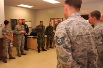 Chief Master Sgt. Jeffry Helm, senior enlisted advisor for the Army and Air Force Exchange Service, discusses potential improvements to the base Exchange with a group of 916th Air Refueling Wing maintenance Airmen here Oct, 13, 2011. Helm toured the 916th ARW's facilities during a recent visit to Seymour Johnson. (USAF photo by SrA Meredith Thomas, 916ARW/PA)
