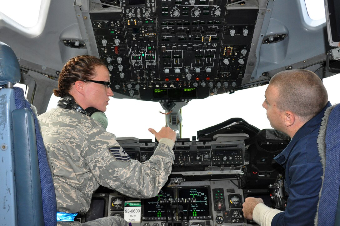 Tech. Sgt. Georgia Wuorio, 315th Aircraft Maintenance Squadron from Joint Base Charleston, S.C., trains an active duty airman at Ramstein, Air Base, Germany. Sergeant Wuorio is one of about 40 reservists from Joint Base Charleston and Westover Air Reserve Base, Mass. are participating in a two-week enroute training mission to Ramstein AB, augmenting the active duty workforce and receiving valuable training in the process. (U.S. Air Force photo by 2nd Lt. Jeff Kelly)