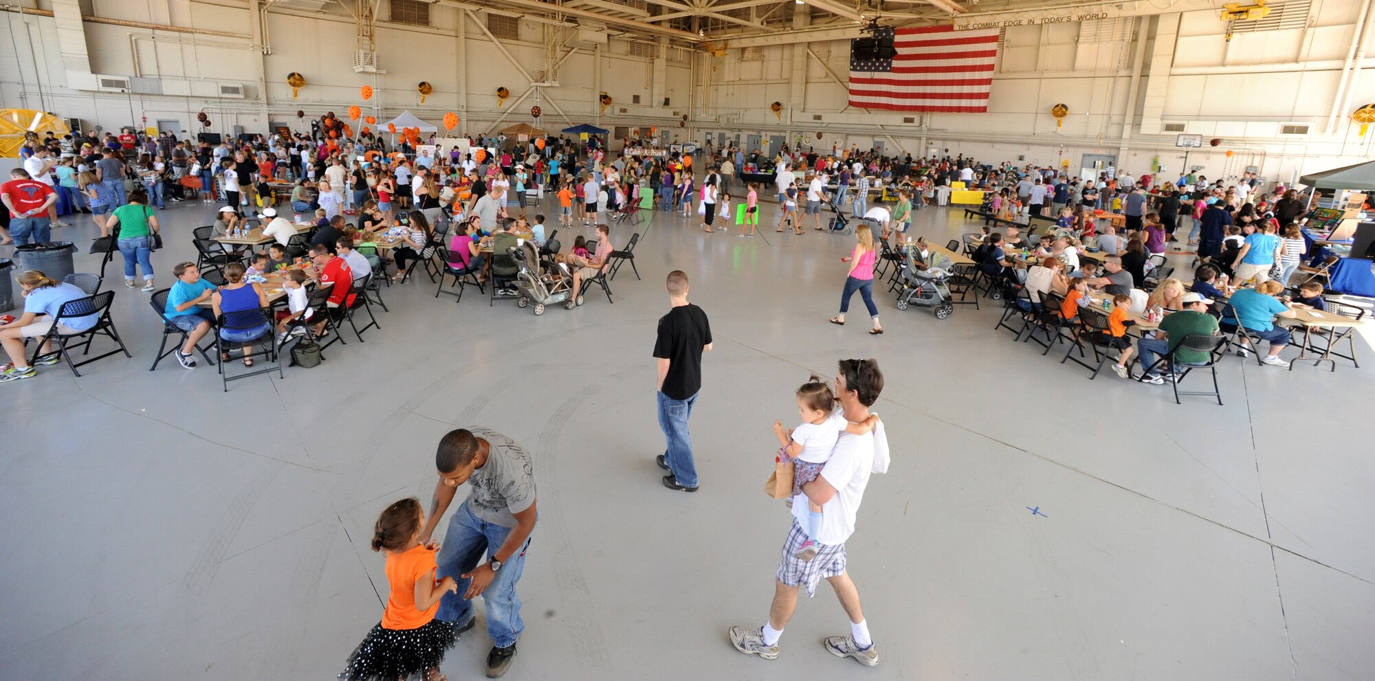 Military and family members enjoy the Fall Festival held at the Freedom Hangar, Hurlburt Field, Fla., Oct. 15, 2011. Attendees had access to aircraft static displays, food vendors, activities for children and more. (U.S. Air Force photo/Senior Airman Eboni Reams)

