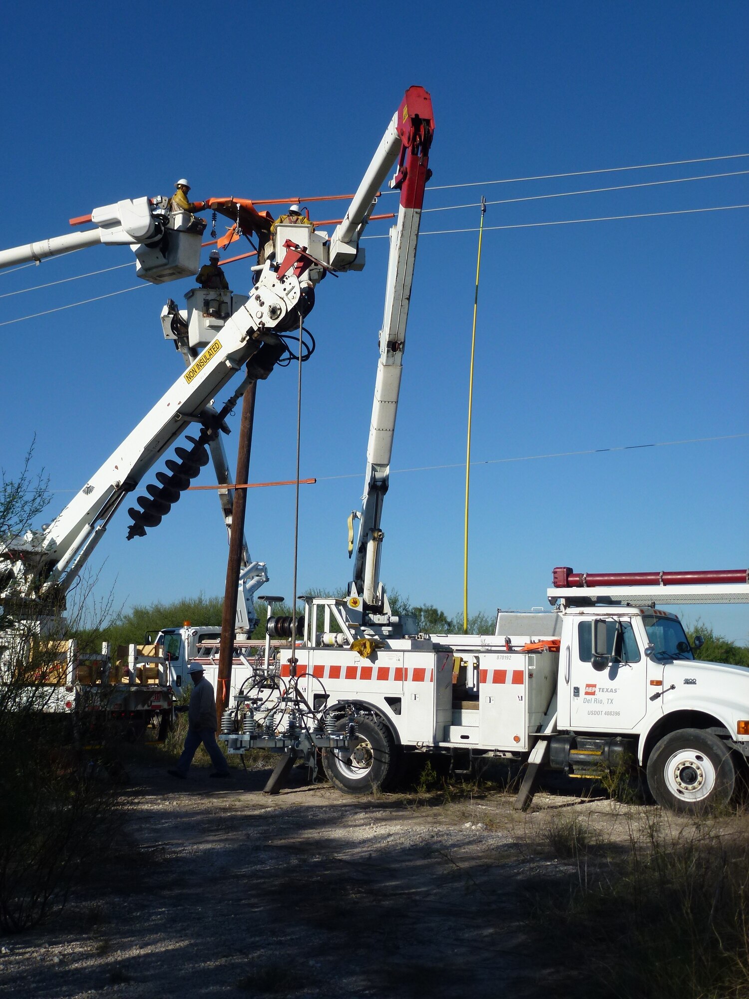 LAUGHLIN AIR FORCE BASE, Texas—Linemen repair power lines here Oct. 14 to correct power outage problems occurring in base housing. Wing leadership, along with the 47th Civil Engineering Squadron and commercial partners, American Electric Power and Rio Grande Electric Co-op, have placed the highest priority on identifying and fixing the most probable causes of the outages. (U.S. Air Force photo/David Morin)