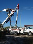 LAUGHLIN AIR FORCE BASE, Texas—Linemen repair power lines here Oct. 14 to correct power outage problems occurring in base housing. Wing leadership, along with the 47th Civil Engineering Squadron and commercial partners, American Electric Power and Rio Grande Electric Co-op, have placed the highest priority on identifying and fixing the most probable causes of the outages. (U.S. Air Force photo/David Morin)