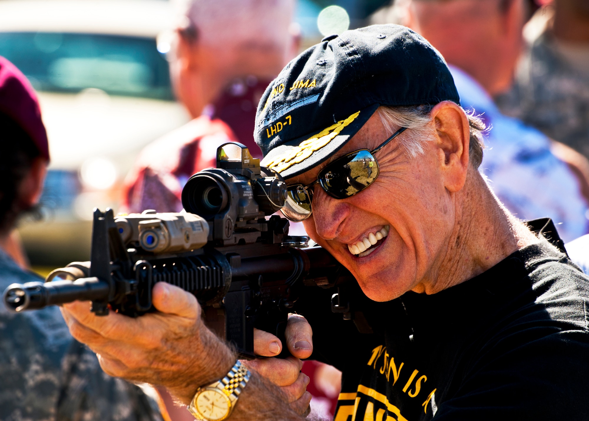 An Army parent checks out the latest weaponry during the 7th Special Forces Group's ribbon cutting ceremony and open house Oct. 14.  Attendees toured grounds, got to check out the state-of-the-art equipment and witnessed Army demonstrations.  The open house concluded a six-year journey for the group who left Fort Bragg, N.C., as a result of the 2005 Base Realignment and Closure process.  (U.S. Air Force photo/Samuel King Jr.)