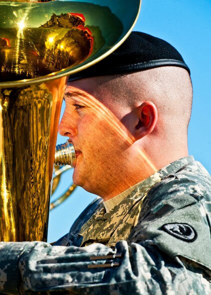 An Army specialist performs the National Anthem at the 7th Special Forces Group's ribbon cutting ceremony and open house Oct. 14.  After the ceremony, attendees toured grounds, got to check out the state-of-the-art equipment and witnessed Army demonstrations.  The open house concluded a six-year journey for the group who left Fort Bragg, N.C. as a result of the 2005 Base Realignment and Closure process.  (U.S. Air Force photo/Samuel King Jr.)