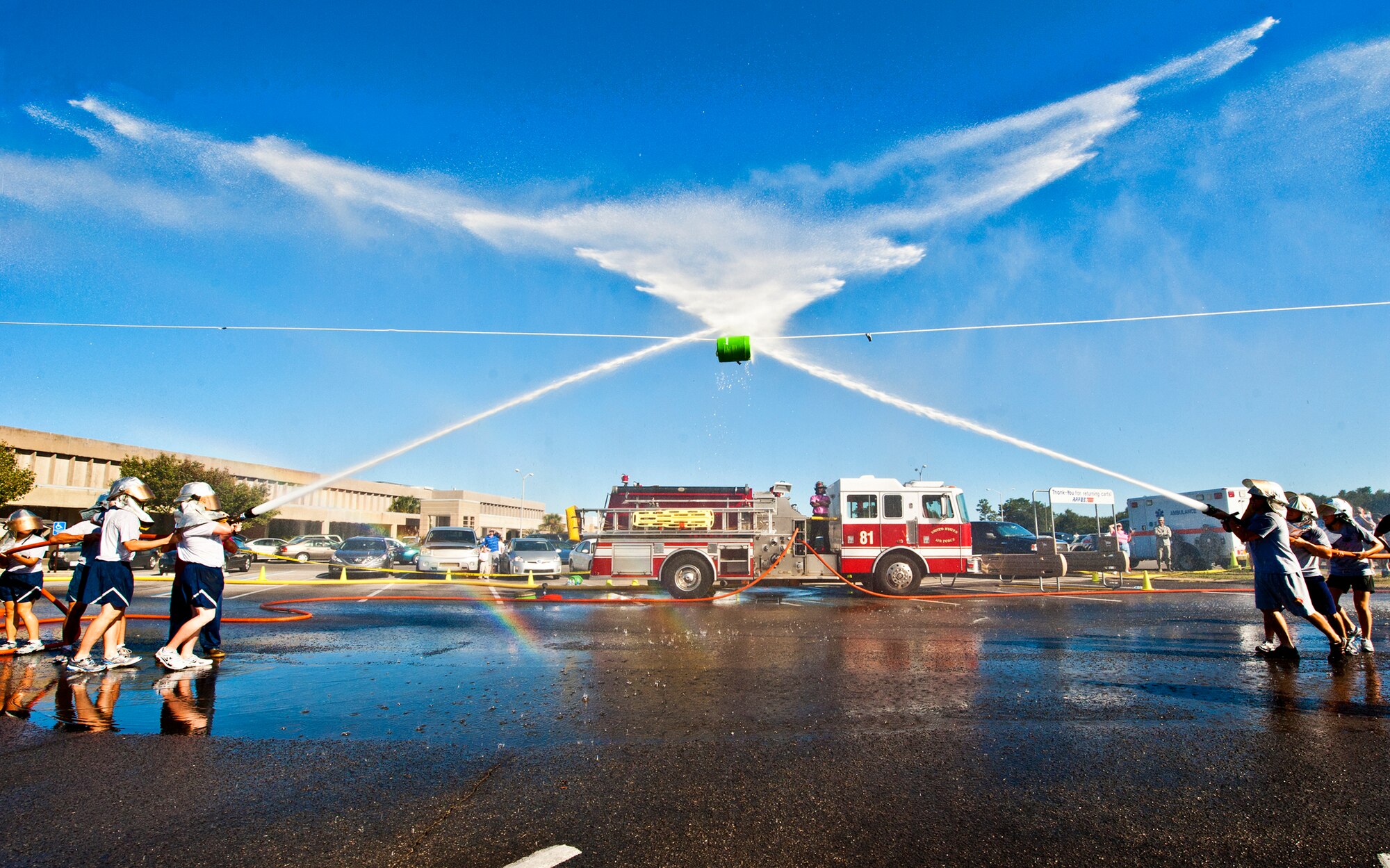 Two teams battle in the water joust competition of this year's Fire Muster Challenge Oct. 14 at Eglin Air Force Base, Fla.  The competition concluded Eglin fire department's Fire Prevention Week campaign.  (U.S. Air Force photo/Samuel King Jr.)