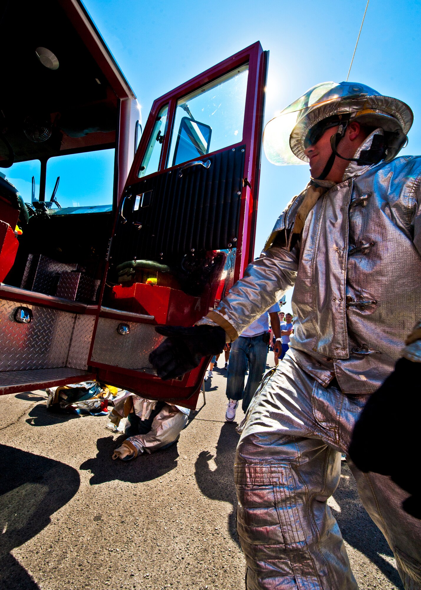 A Fire Muster Challenge contestant rushes to get into the fire engine while dressed out in a fire suit during this year's competition Oct. 14 at Eglin Air Force Base, Fla.  The competition concluded Eglin fire department's Fire Prevention Week campaign.  (U.S. Air Force photo/Samuel King Jr.)