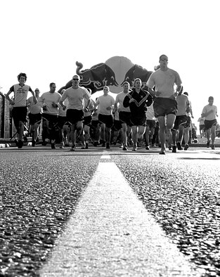 RAF MILDENHALL, England – Team Mildenhall members take off at the beginning of a 5K run here Oct. 14, 2011 which was one of several events held for Fire Prevention Week. Other events included a fire muster challenge, fire department open house and an educational visit to the Child Development Center. (U.S. Air Force photo/Senior Airman Ethan Morgan)