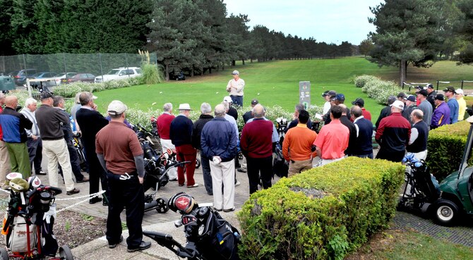 RAF LAKENHEATH, England – Col. Kyle Voigt, 100th Air Refueling Wing vice commander, gathers golfers together on the first tee box at the Breckland Pines Golf Club, RAF Lakenheath, Oct. 14, 2011, to go through the rules for the inaugural British-American Committee ‘Challenge Cup.’ A ‘Ryder Cup’-style better-ball format was used for the 11 matches. Each match was between two teams of two golfers, one representing the United States and the other Great Britain. All four golfers played their own ball throughout the round, and each hole was won by the team whose individual golfer had the lowest score after handicap. The maximum handicap allowed was 18. (U.S. Air Force photo/Senior Airman Ethan Morgan) 