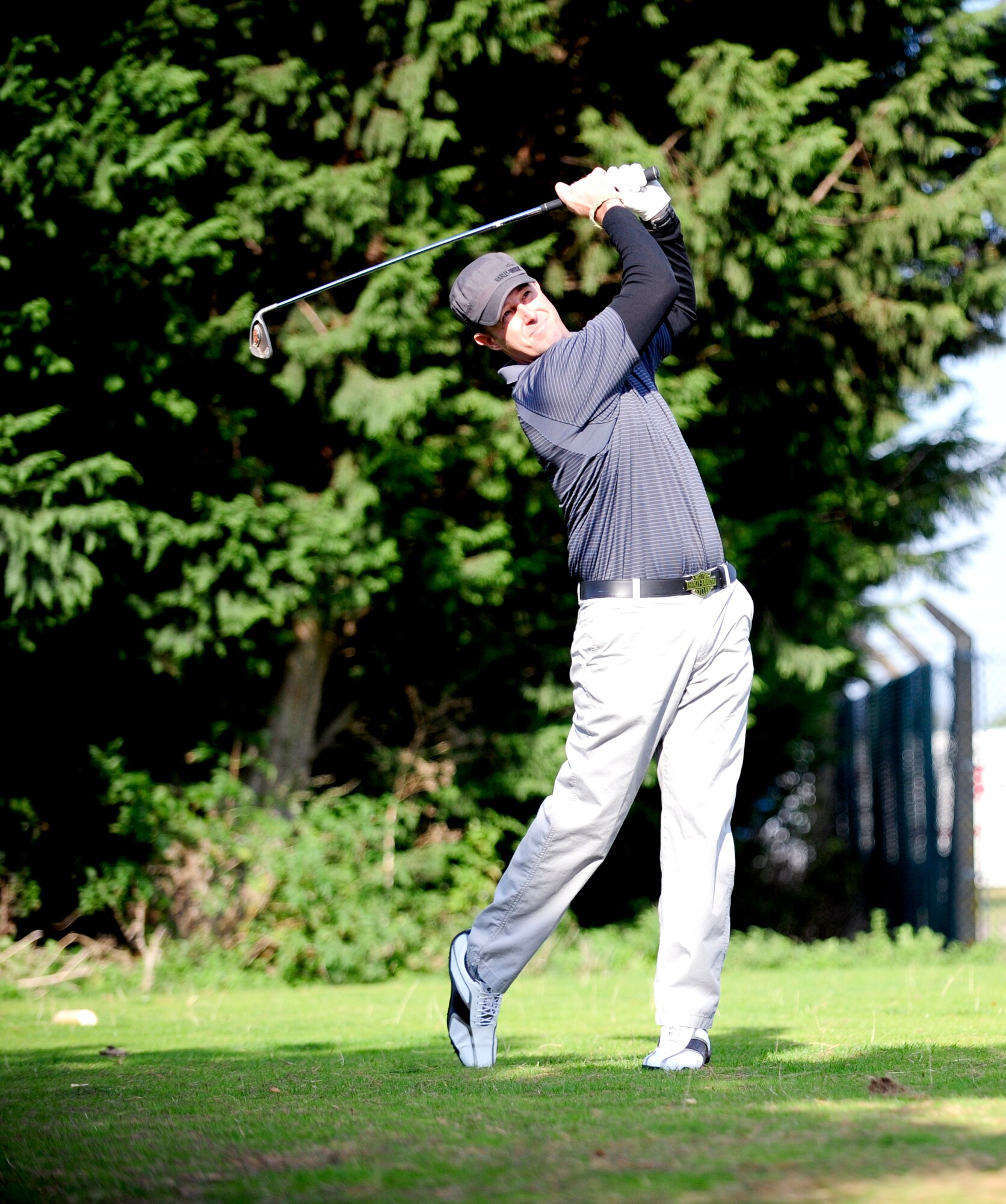 RAF LAKENHEATH, England – Eric Dudash, 100th Maintenance Squadron, a 10-handicap golfer representing the U.S. hits an 8-iron into the 160 yard par-3 fourth hole during the British-American Committee ‘Challenge Cup’ at Breckland Pines Golf Club, RAF Lakenheath, Oct. 14, 2011. His ball landed on the front of the green to give him and his team a birdie putt. (U.S. Air Force photo/Senior Airman Ethan Morgan)