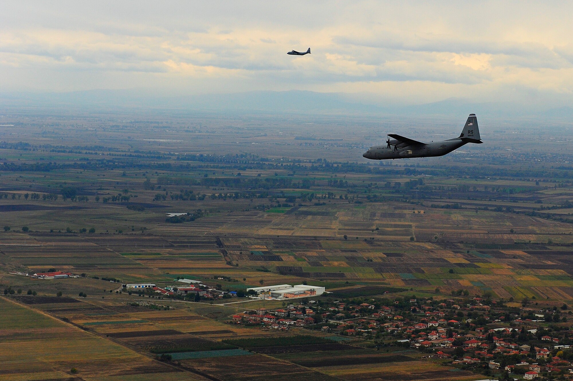 C-130J aircraft from the 37th Airlift Squadron, Ramstein Air Base, Germany, fly over Plovdiv, Bulgaria, during Exercise Thracian Fall 2011, Oct. 17, 2011. Thracian Fall is an off-station training exercise designed to enhance interoperability between U.S. and Bulgarian Air Forces as well as build partnerships with paratroopers from both. (U.S. Air Force photo by Senior Airman Stephen J. Otero)