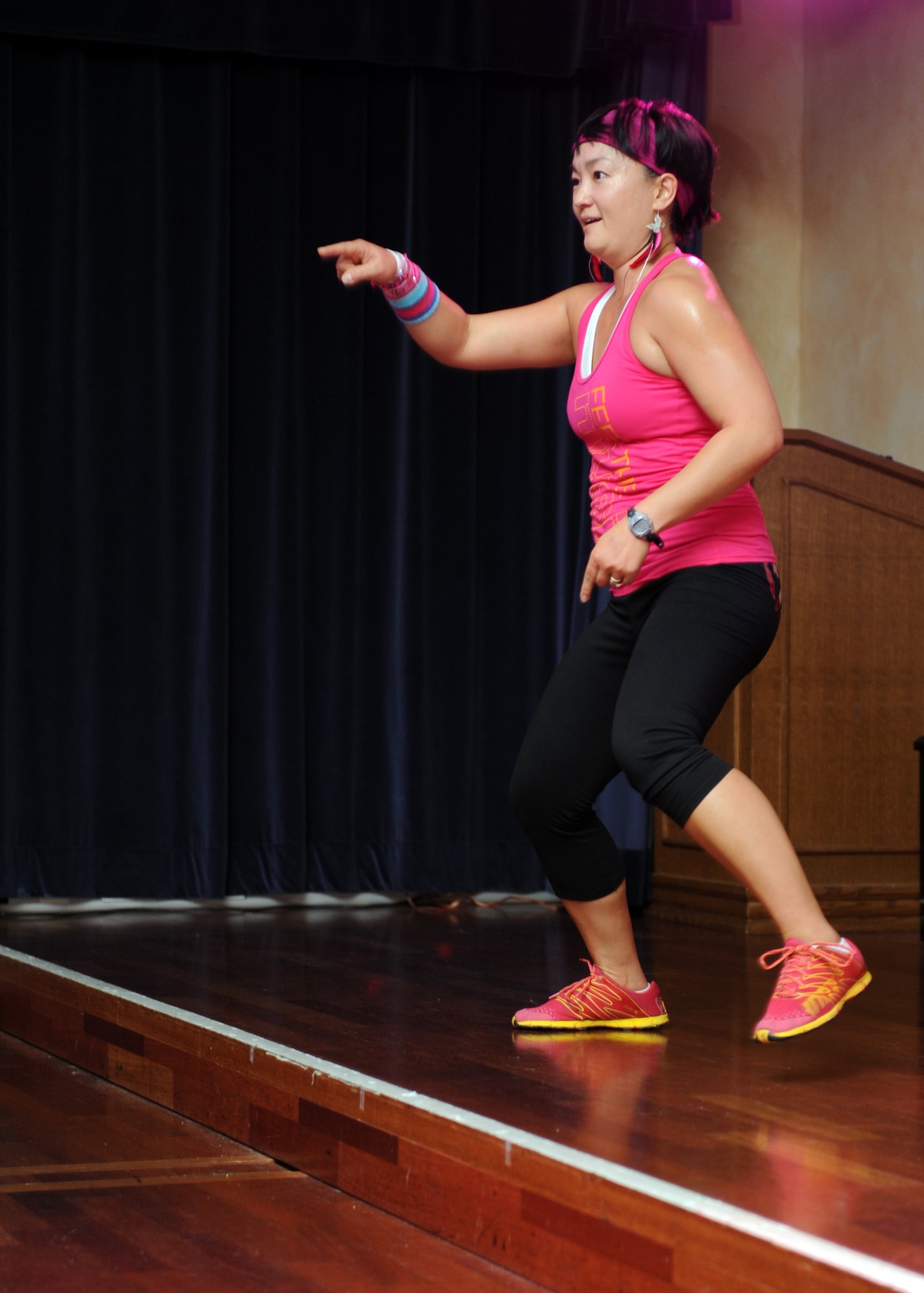 SPANGDAHLEM AIR BASE, Germany – Kim Groder, wife of Master Sgt. Michael Groder, 52nd Security Forces Squadron, leads the more than 130 participants during a dance at the Zumba for a Cure event in support of Breast Cancer Awareness Month here Oct. 13. Zumba for a Cure raised more than $2,000 toward the Susan G. Komen Foundation for Breast Cancer Research. (U.S. Air Force photo/Senior Airman Christopher Toon)