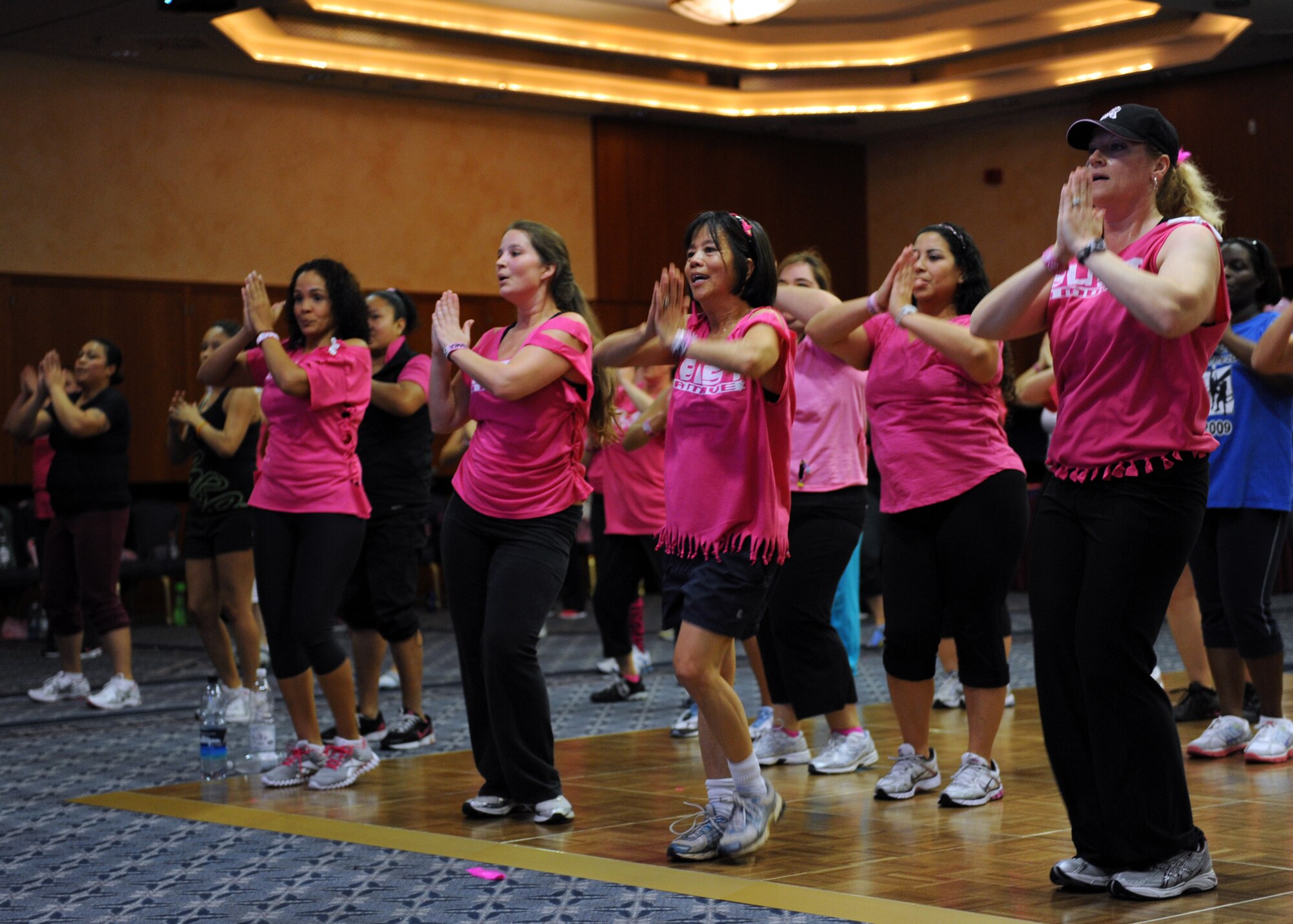 SPANGDAHLEM AIR BASE, Germany – More than 130 participants dance during the Zumba for a Cure event in support of Breast Cancer Awareness Month here Oct. 13. Zumba for a Cure raised more than $2,000 toward the Susan G. Komen Foundation for Breast Cancer Research. (U.S. Air Force photo/Senior Airman Christopher Toon)