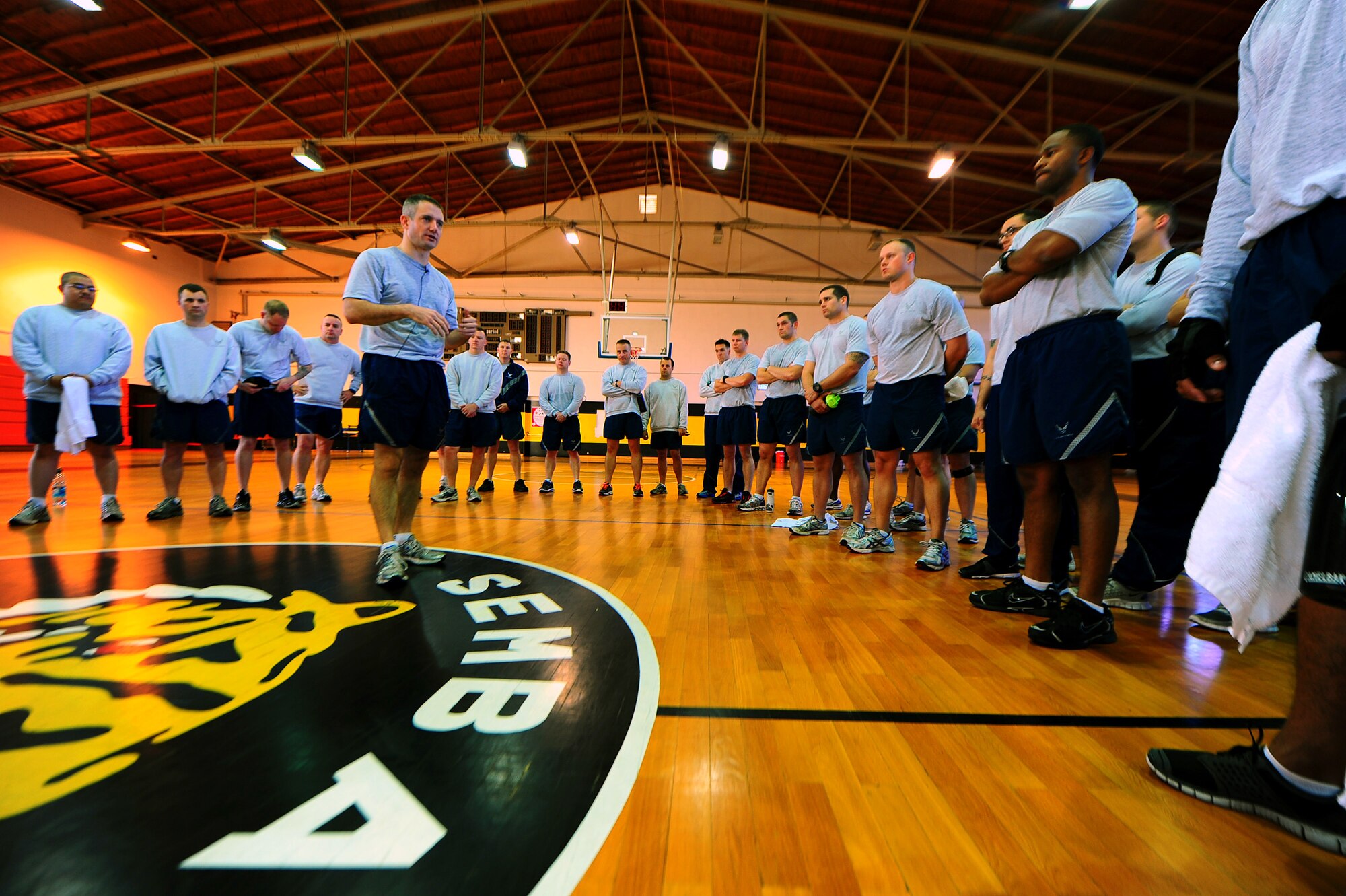 Air Force Maj. Jason Medsger, 435th Security Forces Squadron commander, addresses security forces personnel from the 569th SFS, 435th SFS and 52nd SFS, after performing a memorial workout, Sembach Kaserne, Germany, Oct. 14, 2011. The workout was in honor of Airman 1st Class LeeBernard Chavis, a fallen member of the 824th Security Forces Squadron, Moody Air Force Base, Ga.; it consisted of 150 burpees, a one mile run and 150 squat thrusters. (U.S. Air Force photo by Airman 1st Class Brea Miller)