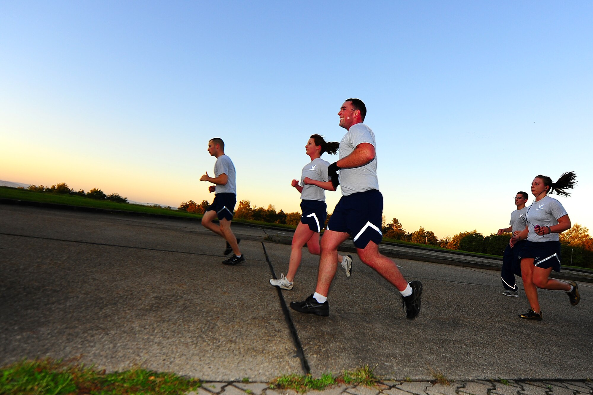 Air Force security forces personnel from the 435th Security Forces Squadron, 569th SFS and 52nd SFS, run during a memorial workout, Sembach Kaserne, Germany, Oct. 14, 2011. The workout was in honor of Airman 1st Class LeeBernard Chavis, a fallen member of the 824th Security Forces Squadron, Moody Air Force Base, Ga.; it consisted of 150 burpees, a one mile run and 150 squat thrusters. (U.S. Air Force photo by Airman 1st Class Brea Miller)