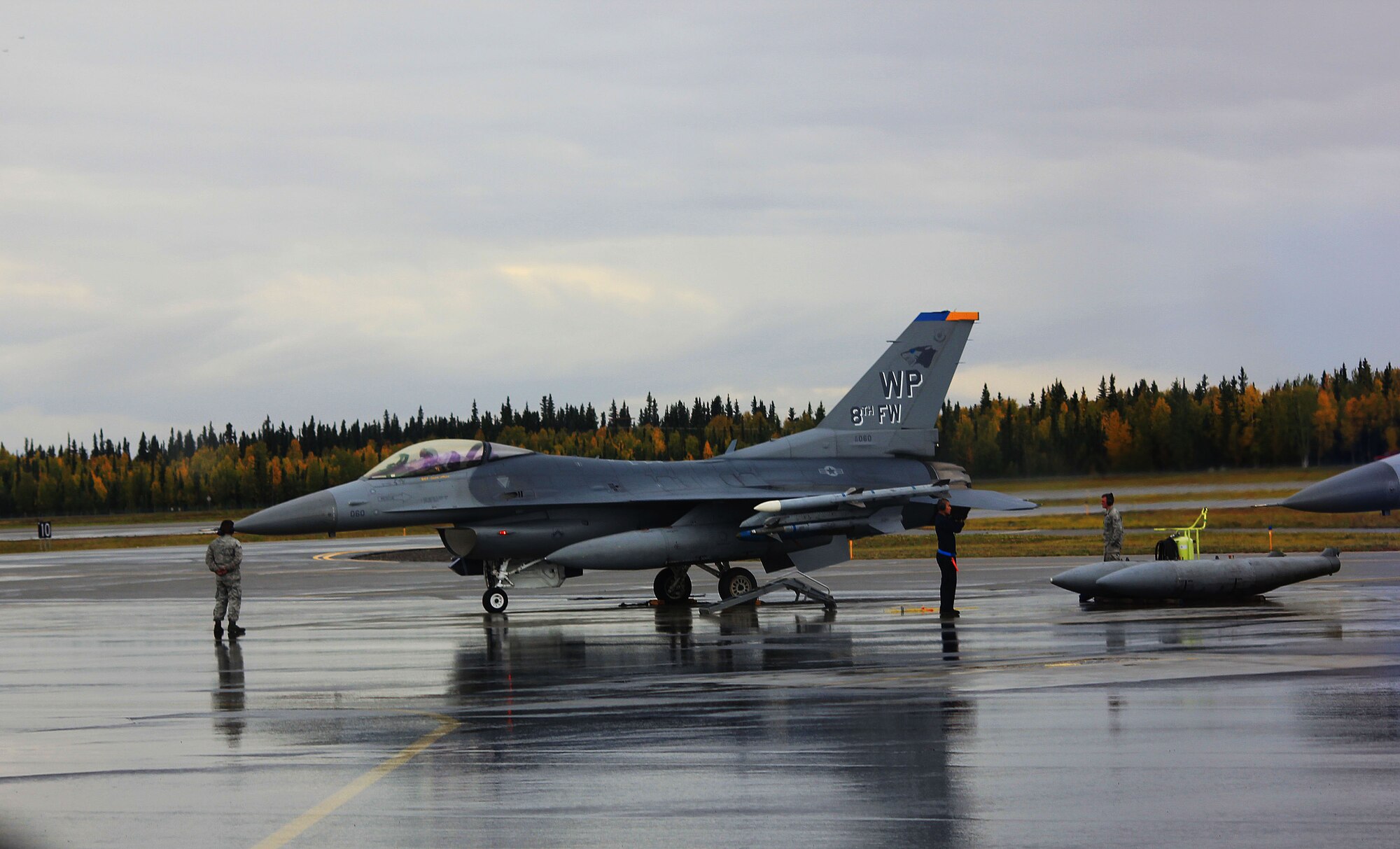 An F-16 Fighting Falcon of the 8th Fighter Wing deployed from Kunsan Air Base, Republic of Korea, is prepared for a mission during Red Flag Alaska 11-3 at Eielson Air Force Base, Alaska, Sept. 9, 2011. RFA is a realistic 10-day air combat training exercise designed to bring Airmen together from all different platforms and backgrounds to execute in a multi-service environment. (U.S. Air Force photo by Staff Sgt. Kurtis Hoar/Released)