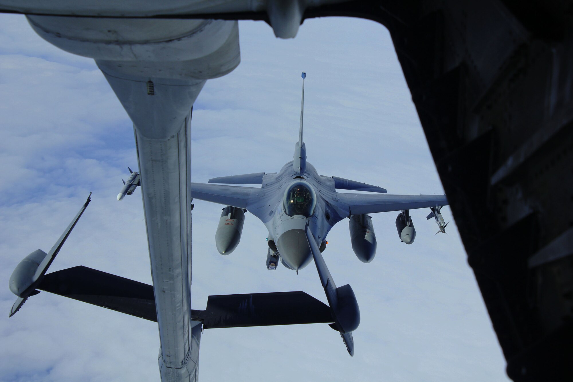 An F-16 Fighting Falcon of the 35th Fighter Squadron deployed from Kunsan Air Base, Republic of Korea, refuels during Red Flag Alaska 11-3 at Eielson Air Force Base, Alaska, Aug. 8, 2011. RFA is a realistic 10-day air combat training exercise designed to bring Airmen together from all different platforms and backgrounds to execute in a multi-service environment. (U.S. Air Force photo by Staff Sgt. Kurtis Hoar/Released)