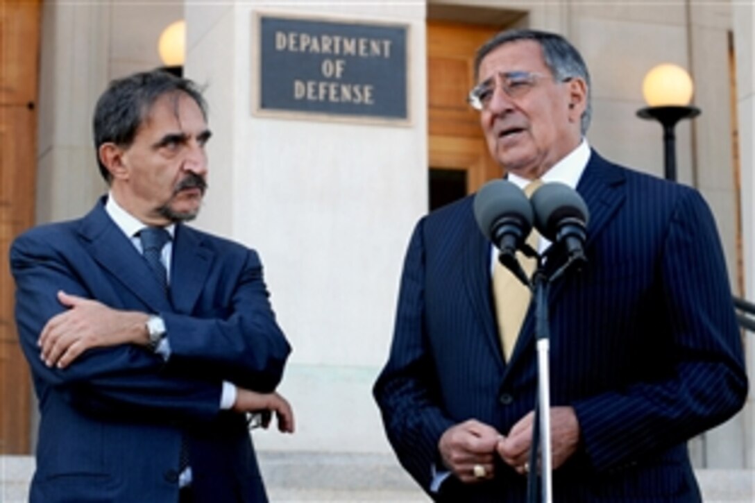 Defense Secretary Leon E. Panetta, right, responds to a reporter's question during a joint media availability with Italian Defense Minister Ignazio La Russa, left, outside the Pentagon, Oct. 17, 2011.  