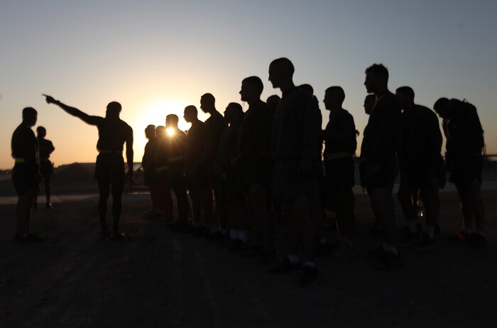 A Marine explains the route for the 3-mile run portion of an initial physical fitness test to students enrolled in the 2nd Marine Logistics Group (Forward) Corporal’s Course aboard Camp Leatherneck, Afghanistan, Oct. 18. Upon graduation, the young NCOs will have the tools they need to manage and direct their Marines effectively. (U.S. Marine Corps photo by Sgt. Justin J. Shemanski)