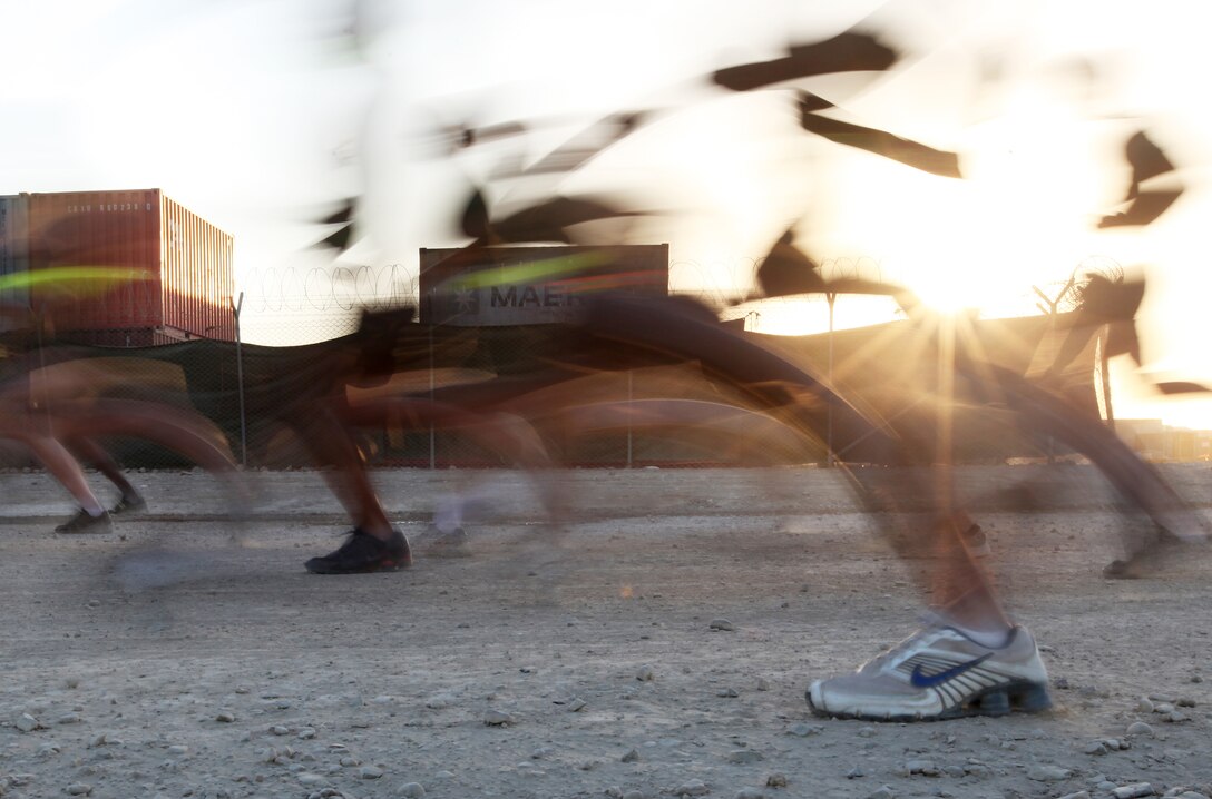 Marines dash away from the starting point of the 3-mile run portion of an initial physical fitness test aboard Camp Leatherneck, Afghanistan, Oct. 18. The NCOs are currently enrolled in the 2nd Marine Logistics Group (Forward) Corporal’s Course, which began Oct. 17. (U.S. Marine Corps photo by Sgt. Justin J. Shemanski)