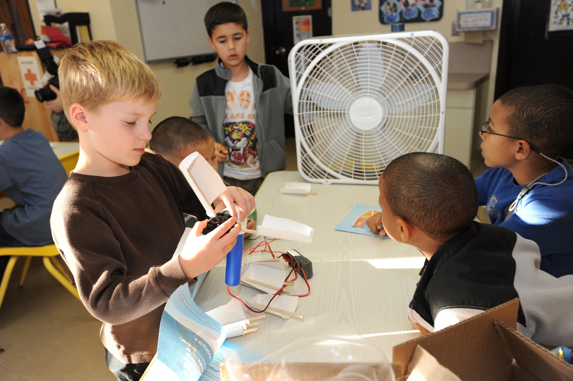 MISAWA AIR BASE, Japan -- Children from the Cheli School Age Program build windmills for the 'Wired for Wind' project during Federal Energy Awareness month here Oct. 18. 'Wired for Wind' is an in-depth look at renewable energy technologies in the form of wind power.  (U.S. Air Force photo by Airman 1st Class Kia Atkins)