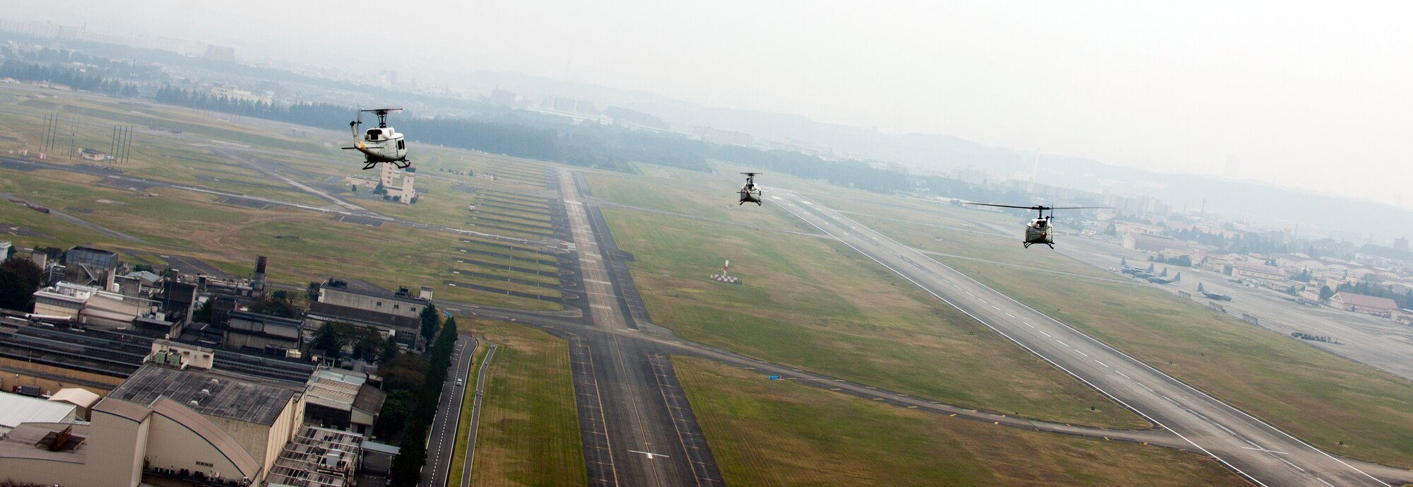 YOKOTA AIR BASE, Japan -- UH-1N Iroquois helicopters from the 459th Airlift Squadron prepare to land at Yokota Air Base, Japan, Oct.14, 2011. The UH-1Ns flew in a four-ship formation, to improve larger formation proficiency. (U.S. Air Force photo/Airman 1st Class Krystal M. Garrett)
