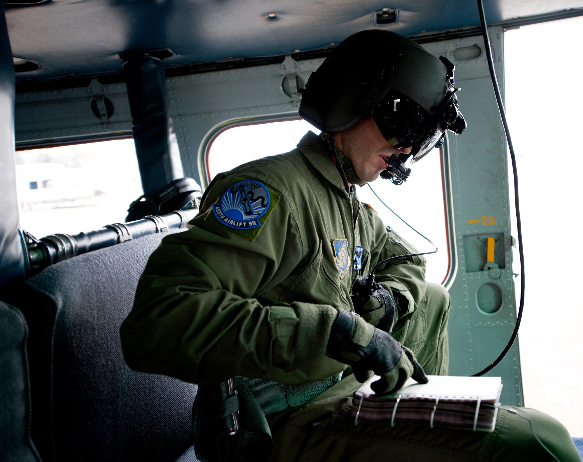 YOKOTA AIR BASE, Japan -- Staff Sgt. Andrew Schloemer, 459th Airlift Squadron flight engineer, prepares for a four-ship formation flight at Yokota Air Base, Japan, Oct. 14, 2011. The four-ship formation allows the squadron to test its capabilities. (U.S. Air Force photo/Airman 1st Class Krystal M. Garrett)    