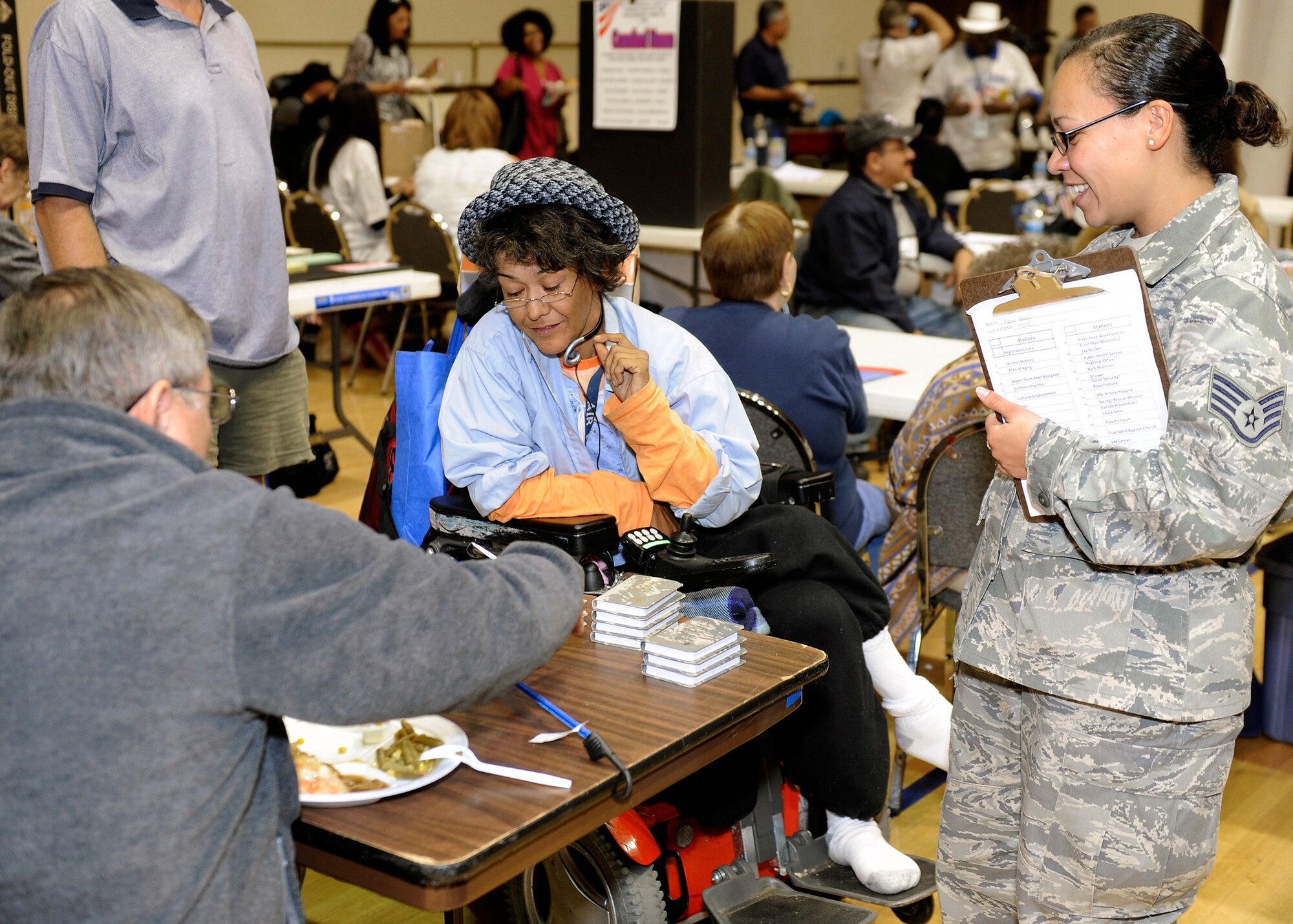SCHRIEVER AIR FORCE BASE, Colo. -- Staff Sergeant Patricia Montez from Schriever's Space Innovation and Development Center escorts Robin Adams through various stations at the 13th annual Vetrans Stand Down. The event drew more than 120 homeless or impoverished veterans to the City Auditorium downtown. This event connected them with the federal services they are eligible to receive and provided them with much needed clothing and a hot meal.
(U.S. Air Force Photo/David Ahlschwede)




