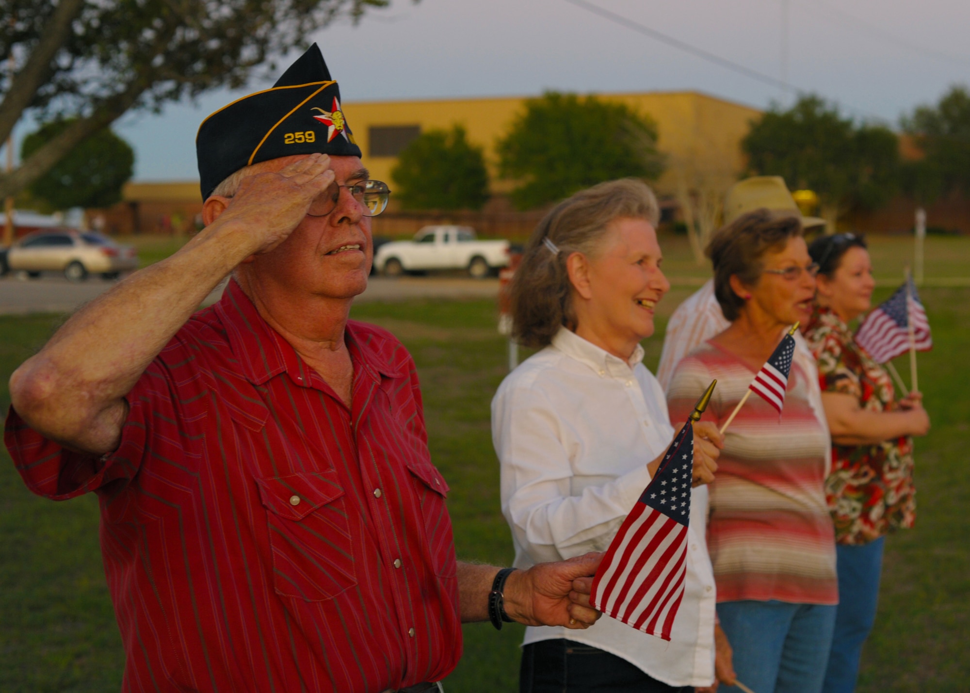 Tom Higgins, Vietnam veteran and former Air Force H-21 pilot, renders a salute as Air Force Special Tactics Airmen pass by during the Tim Davis Memorial March in Weimar, Texas, Oct. 17, 2011. The 812-mile march, which began in San Antonio, Texas, honors fallen Special Tactics Airmen and will span across five states before ending at the Special Tactics Training Squadron at Hurlburt Field, Fla., Oct. 26, 2011. (U.S. Air Force photo by Staff Sgt. Sharida Jackson)