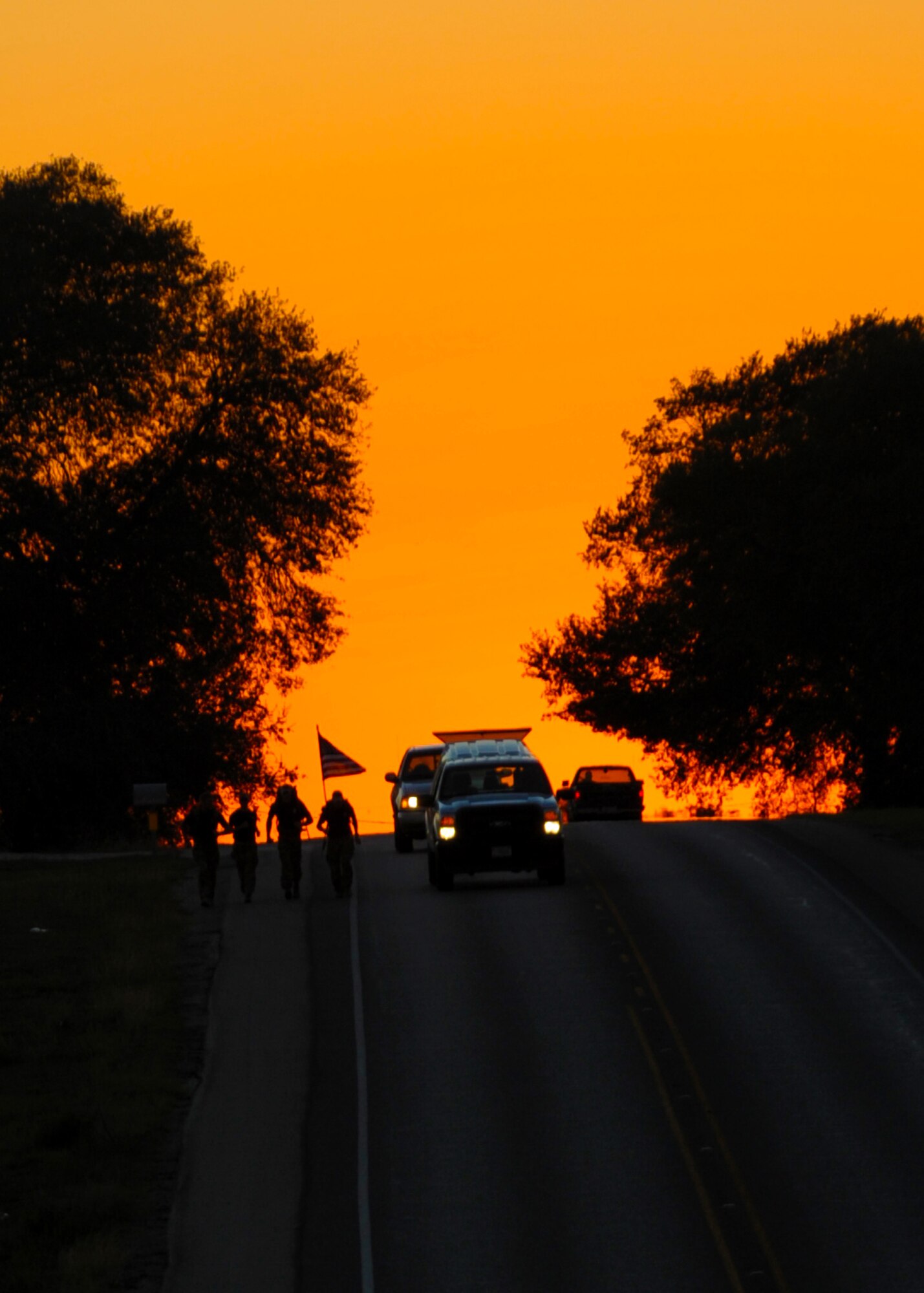 Members of Team 5 pass through Schulenburg, Texas, during the Tim Davis Memorial March Oct. 17, 2011. The march, which began in San Antonio, Texas,  honors fallen Special Tactics Airmen and consists of six three-man teams relaying 24 hours a day. Each team will walk about 144 miles while carrying 50-pound rucksacks.  The march ends at Hurlburt Field, Fla., Oct. 26, 2011. (U.S. Air Force photo by Staff Sgt. Sharida Jackson)