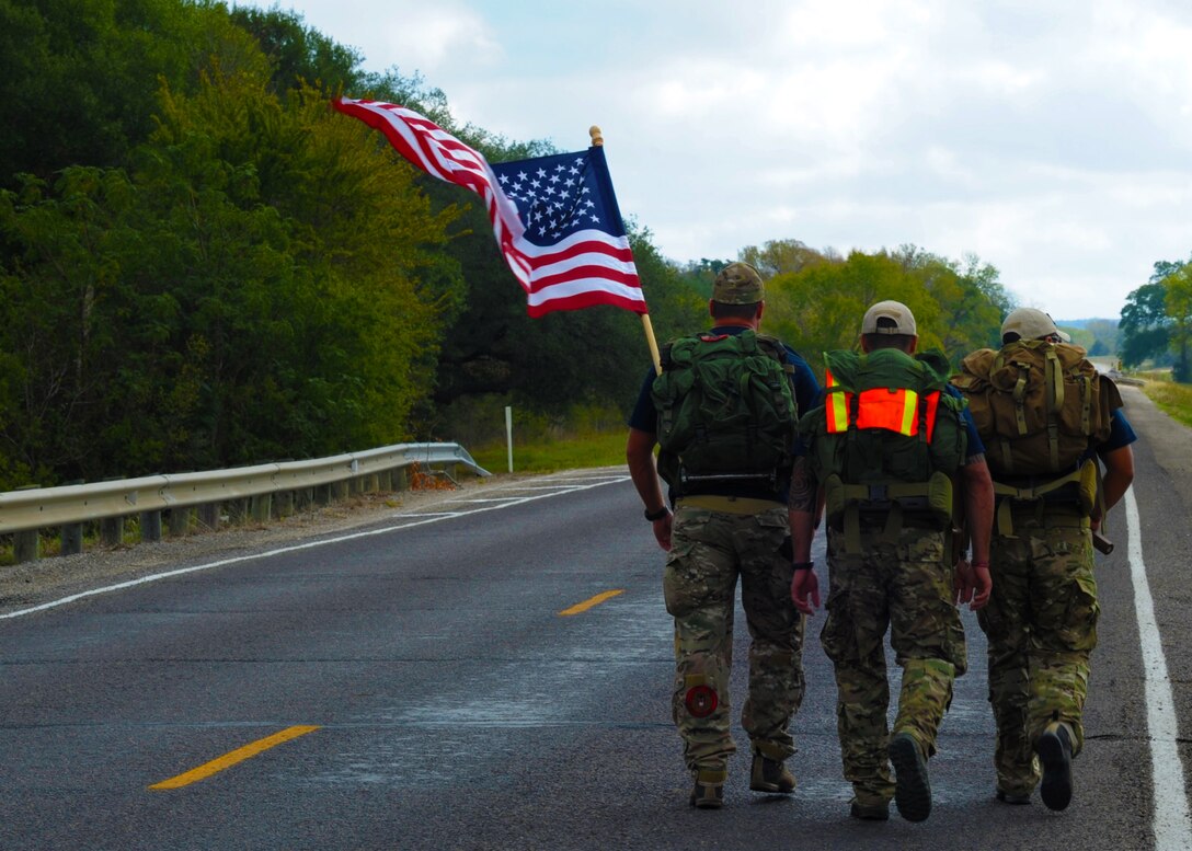 Members of Team 3 pass through Flatonia, Texas, during the Tim Davis Memorial March Oct. 17, 2011. The march, which honors fallen Special Tactics Airmen, consists of six three-man teams and will span across five states before ending at the Special Tactics Training Squadron at Hurlburt Field, Fla., Oct. 26, 2011. (U.S. Air Force photo by Staff Sgt. Sharida Jackson)