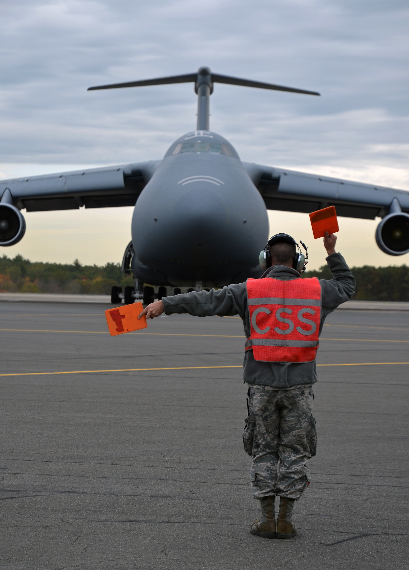 A Patriot Wing maintainer marshals a C-5 aircrew outbound from the flight line at Westover ARB, Mass., Oct, 18. Westover's 439th Airlift Wing is part of the Air Force-wide surge of C-5s taking place throughout this week. The C-5 is the U.S. military's largest aircraft. (U.S. Air Force photo/SrA. Kelly Galloway)