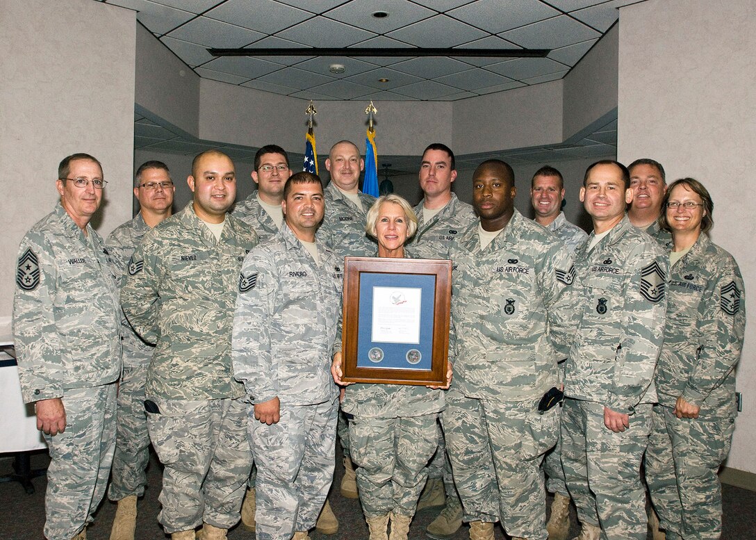Thirty Airmen from the 137th Security Forces Squadron are honored at the Hometown Heroes recognition ceremony held on base Sept. 11. This award is for all members who deployed for greater than 30 days.