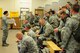 Tech. Sgt. Angela O'Hara briefs members of the 148th Fighter Wing during an outprocessing briefing prior to deploying to Nellis Air Force Base, Nev. for a final two week conversion training mission.  The 148th Fighter Wing is one of only two bases and the only Guard unit with the Block 50 F-16 to specialize in the suppression of enemy air defense (SEAD) and destruction of enemy air defense (DEAD) mission.     (National Guard photo by Tech. Sgt. Brett R. Ewald.)