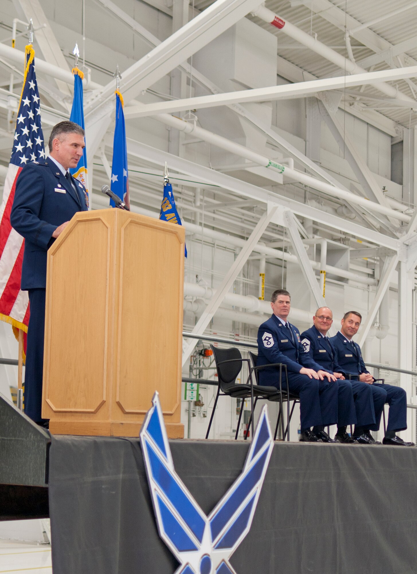 Col. Greg Haase (left), 133rd Airlift Wing commander applauds the work of outgoing Wing command chief, Chief Master Sgt. David Speich (2nd from right), 133rd Civil Engineer Squadron, and introduces his new top enlisted member for the 133rd AW, Chief Master Sgt. Paul Kessler (far right), 133rd Communications Flight, during a change of authority ceremony at the Air Guard base in St. Paul, Minn. on Oct. 15, 2011. Minnesota Air National Guard command chief, Chief Master Sgt. Greg Close (2nd from left) assists. USAF official photo by Airman 1st Class Kari Giles